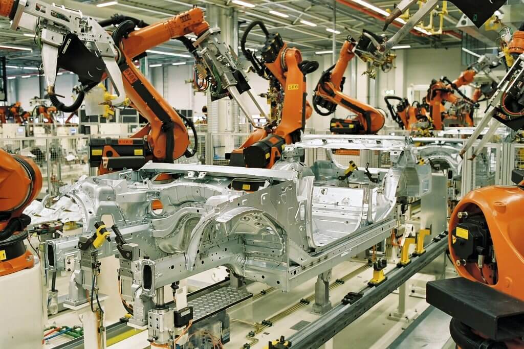 Spot welding in the automotive industry — BMW plant in Leipzig, Germany: Spot welding of BMW 3 series car bodies with KUKA industrial robots.